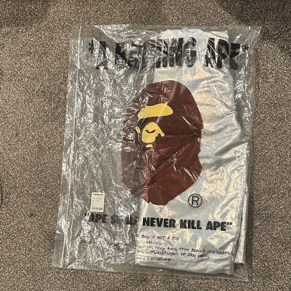 A Bathing Ape Silver Graphic Windbreaker - Silver reflective Ape Logo
